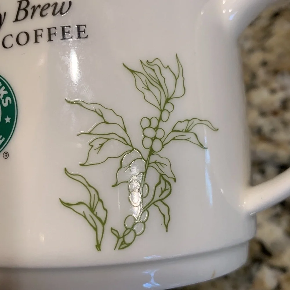 We Proudly Brew Starbucks coffee mug 12 ounces White and green
